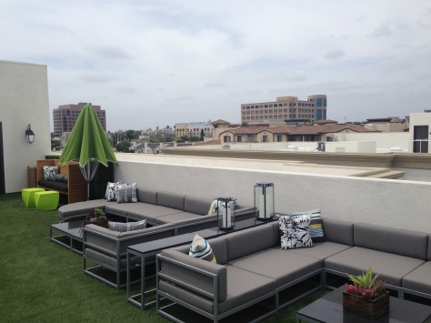 A sheik rooftop lounge is a great gathering place to entertain and look down on the rooftops of nearby buildings.