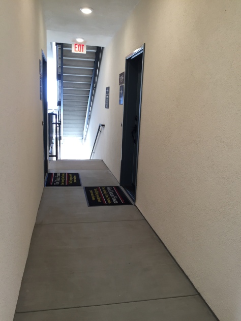Hallway entrances remind me of apartment and motel buildings.